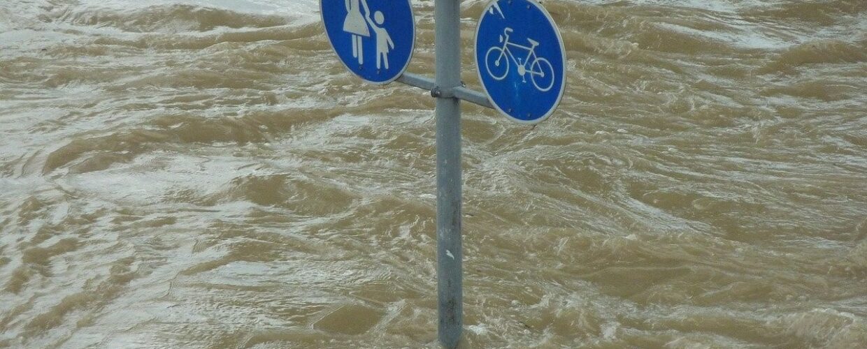 Road sign in flood water