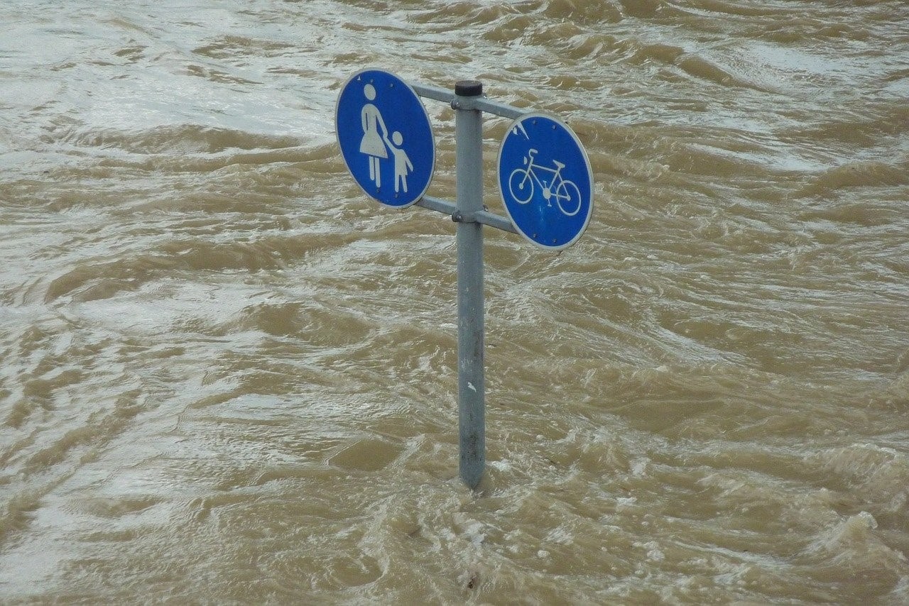 Road sign in flood water