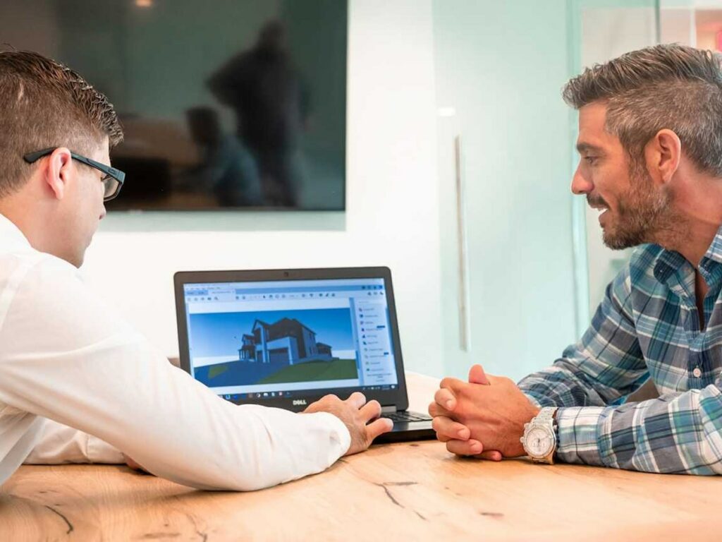 2 people looking at laptop screen