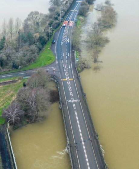 Birds eye view of roads in the middle of flooded surroundings
