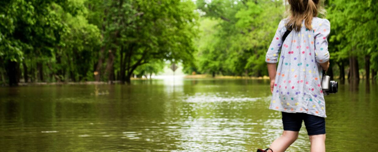 Little girl standing in water