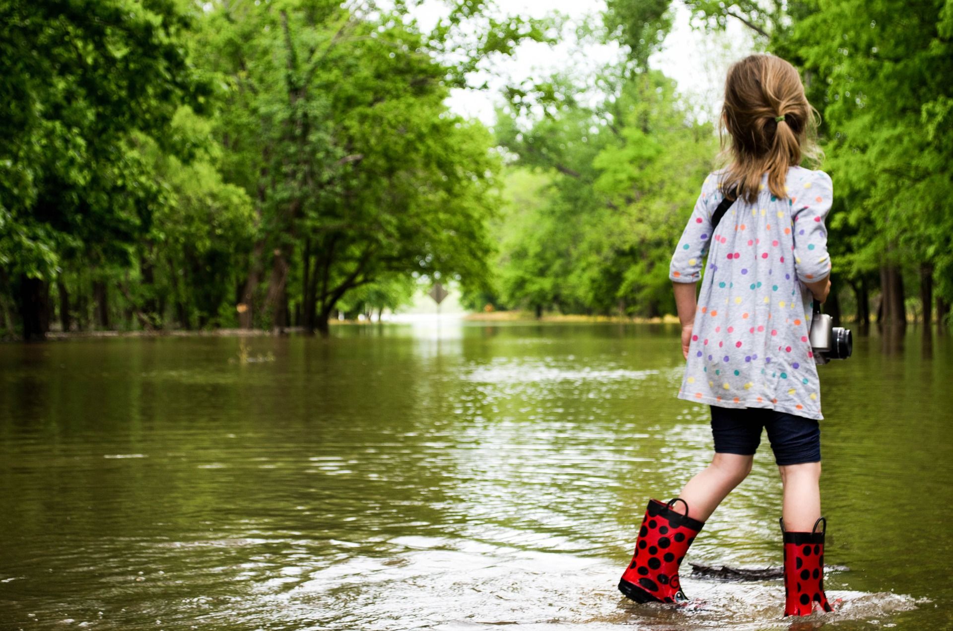 Little girl standing in water