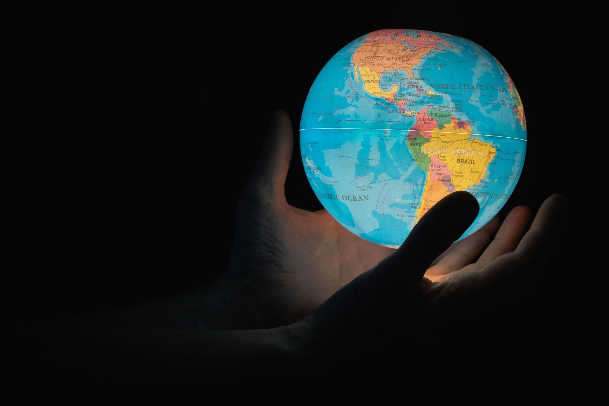 greg-rosenke-1TjORT2dLOw-unsplash (world) Holding light-up globe of world