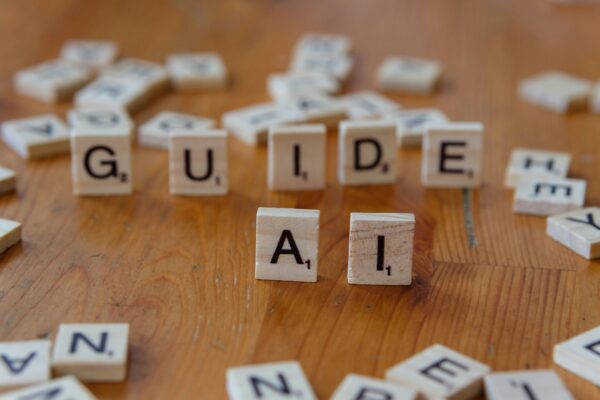 Scrabble tiles spelling GUIDE AI