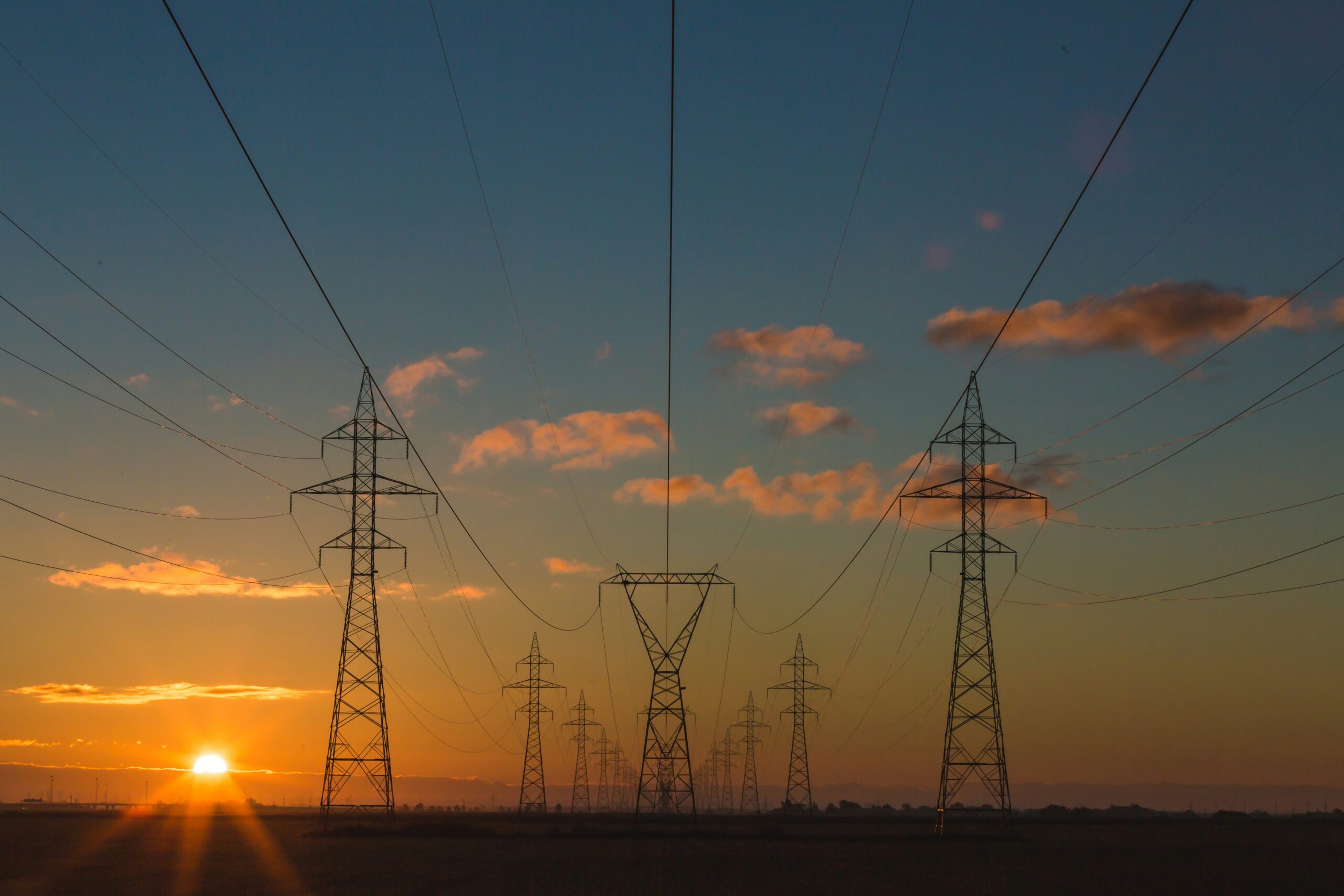 Electricity pylons at sunset